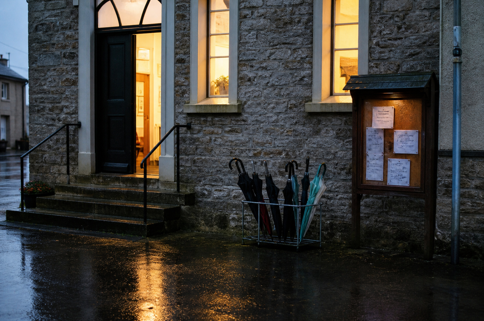 Umbrellas outside a village hall